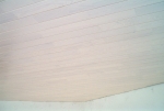 Faux-plafond en lamelles PVC avec isolation accoustique